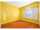 Cozy bedroom with natural light and hardwood floors for a comfortable living space at 9954 N Jasmine Brook E Cir, Land O Lakes, FL 34638