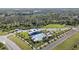 Overhead shot of the community pool area, boasting a modern pool, splash pad, playground, and ample parking at 9954 N Jasmine Brook E Cir, Land O Lakes, FL 34638
