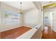 The dining room features hardwood floors and a modern chandelier at 9954 N Jasmine Brook E Cir, Land O Lakes, FL 34638