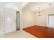 Bright foyer with tile flooring near the entry and hardwood flooring in the adjacent dining room at 9954 N Jasmine Brook E Cir, Land O Lakes, FL 34638