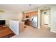 Open kitchen with stainless steel appliances, breakfast bar, tile backsplash, and tile flooring at 9954 N Jasmine Brook E Cir, Land O Lakes, FL 34638