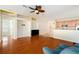 Inviting living area with hardwood floors adjacent to the kitchen, perfect for entertaining at 9954 N Jasmine Brook E Cir, Land O Lakes, FL 34638