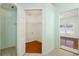 A walk-in closet with wood floor and ample shelving to keep everything organized and easily accessible at 9954 N Jasmine Brook E Cir, Land O Lakes, FL 34638