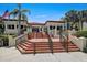 Inviting community entrance with well maintained landscaping and prominent signage at 7564 Bayshore Dr # 306, Treasure Island, FL 33706