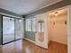 Bedroom featuring hardwood flooring and a sliding glass door leading to a screened porch at 110 W Cypress Ct, Oldsmar, FL 34677