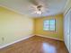 Bedroom with ceiling fan and ample closet space at 110 W Cypress Ct, Oldsmar, FL 34677