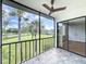 Screened lanai overlooking the green space, perfect for enjoying the outdoors at 110 W Cypress Ct, Oldsmar, FL 34677