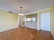 Hardwood floors and light yellow walls add an inviting feel to this condo's living space at 110 W Cypress Ct, Oldsmar, FL 34677