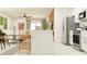 Modern kitchen featuring stainless steel appliances, white cabinets, and breakfast bar seating at 13130 Empress Jewel Trl, Parrish, FL 34219