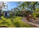 Serene backyard oasis featuring a cozy firepit area and charming shed, perfect for relaxation and outdoor enjoyment at 1543 Gentry St, Clearwater, FL 33755