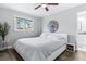 Cozy bedroom with a ceiling fan, window and view of the outside at 1543 Gentry St, Clearwater, FL 33755