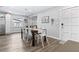 Dining room features a wooden table and white chairs with wood-look flooring at 1543 Gentry St, Clearwater, FL 33755