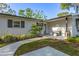 Inviting home entrance with a cozy seating area, stylish accents, and charming curb appeal at 1543 Gentry St, Clearwater, FL 33755