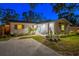 Charming home exterior featuring a tidy lawn, inviting entryway, and tasteful architectural elements at 1543 Gentry St, Clearwater, FL 33755