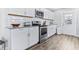 Bright kitchen with stainless steel appliances, subway tile backsplash, and granite countertops at 1543 Gentry St, Clearwater, FL 33755
