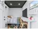 Living space inside the outbuilding with a bed, TV, desk, and a minimalist design at 1543 Gentry St, Clearwater, FL 33755