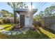 Charming outbuilding with a welcoming entrance, stone pathway, and well-manicured landscaping at 1543 Gentry St, Clearwater, FL 33755