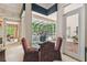 Breakfast nook featuring a glass table and chairs with pool views at 1655 Eagles Reach, Tarpon Springs, FL 34688