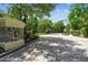 Community entrance gate with brick paved drive, providing privacy and exclusivity at 1655 Eagles Reach, Tarpon Springs, FL 34688