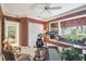 Spacious exercise room with fitness equipment, window seat and patterned wallpaper at 1655 Eagles Reach, Tarpon Springs, FL 34688