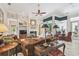 Bright living room featuring a fireplace, high ceilings, and views of the pool and lanai at 1655 Eagles Reach, Tarpon Springs, FL 34688