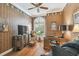 Cozy office space with custom wallpaper, a large window, desk, and TV at 1655 Eagles Reach, Tarpon Springs, FL 34688