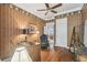 Comfortable office featuring a desk, hardwood floors, unique wallpaper, and custom trim at 1655 Eagles Reach, Tarpon Springs, FL 34688