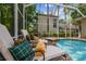 Sun loungers overlooking the screened pool and spa at 1655 Eagles Reach, Tarpon Springs, FL 34688
