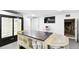 Basement features a custom island, large refrigerator, and convenient access to additional storage spaces at 166 E Davis Blvd, Tampa, FL 33606