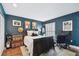 Bedroom with wood floors, a dark wood bed, and shuttered windows at 166 E Davis Blvd, Tampa, FL 33606