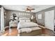 Bedroom with hardwood floors, an elegant chandelier, and plenty of natural light at 166 E Davis Blvd, Tampa, FL 33606