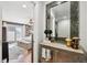 View of bedroom with hard wood floors and a mirror in the hallway at 166 E Davis Blvd, Tampa, FL 33606