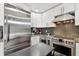 Bright, modern kitchen with Viking appliances and gray subway tile backsplash at 166 E Davis Blvd, Tampa, FL 33606