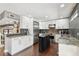 Bright modern kitchen features white cabinets, stainless steel appliances, and granite countertops at 166 E Davis Blvd, Tampa, FL 33606
