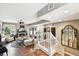 Open-concept living room with hardwood floors, neutral paint, and modern decor, steps leading to the second floor at 166 E Davis Blvd, Tampa, FL 33606