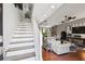Inviting living room with hardwood floors, a staircase and abundant natural light at 166 E Davis Blvd, Tampa, FL 33606