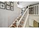 Stairway featuring white railings and wood stairs at 166 E Davis Blvd, Tampa, FL 33606
