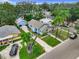 Aerial view of the home featuring its driveway, yard, and neighborhood at 2425 Auburn S St, St Petersburg, FL 33712
