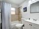 Bathroom showcasing a tiled shower, a white vanity, and a framed mirror for convenience at 2425 Auburn S St, St Petersburg, FL 33712