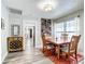 Dining room with a wooden table, wine storage, and access to living areas at 2425 Auburn S St, St Petersburg, FL 33712