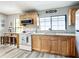 Kitchen with stainless steel appliances, wood cabinets, and plenty of natural light at 2425 Auburn S St, St Petersburg, FL 33712
