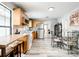 Open concept kitchen and dining area with a breakfast bar and stainless steel appliances at 2425 Auburn S St, St Petersburg, FL 33712