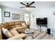 A cozy living area with leather sectional sofa, and a modern glass coffee table at 2425 Auburn S St, St Petersburg, FL 33712