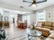 Open living space featuring a wood dining table and comfortable sectional sofa at 2425 Auburn S St, St Petersburg, FL 33712