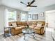 Inviting living room features a comfortable sectional sofa, natural light, and stylish décor at 2425 Auburn S St, St Petersburg, FL 33712