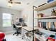 Cozy office space with natural light, shelves, and desk at 2425 Auburn S St, St Petersburg, FL 33712