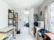 Bright home office with tiled floor, shelves, and abundant natural light at 2425 Auburn S St, St Petersburg, FL 33712