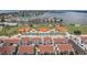 Scenic aerial view of a waterfront community featuring sports fields, tennis courts, and well-maintained residential buildings at 253 Rex Pl # B, Madeira Beach, FL 33708