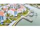 Stunning aerial view of waterfront townhomes, docks, and boats on the water at 253 Rex Pl # B, Madeira Beach, FL 33708