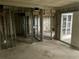 Unfinished basement with door to the outside. Block walls and metal framing awaiting customization at 253 Rex Pl # B, Madeira Beach, FL 33708